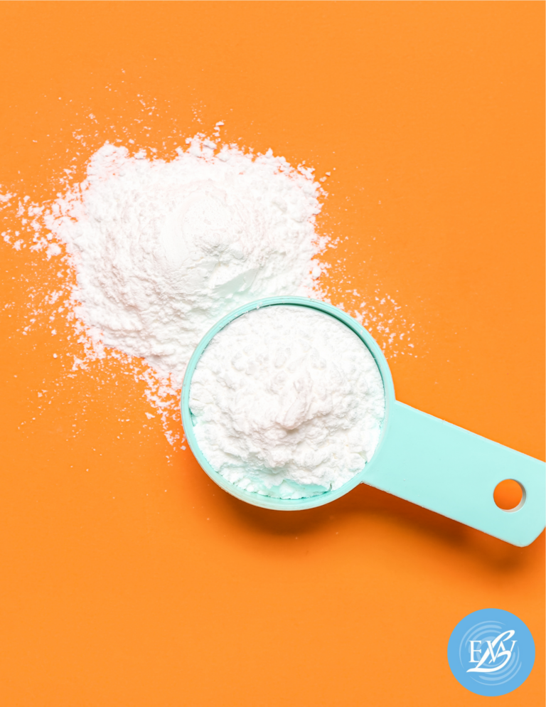 Creatine supplement scoop and powder