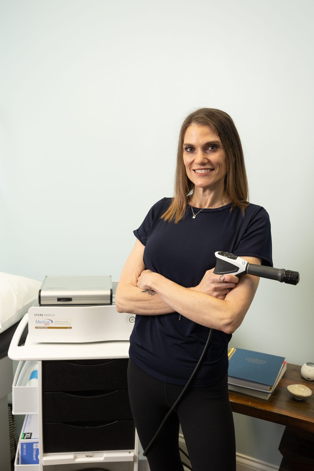 Amanda Carter, FNP-C with the GAINSWave shockwave therapy device