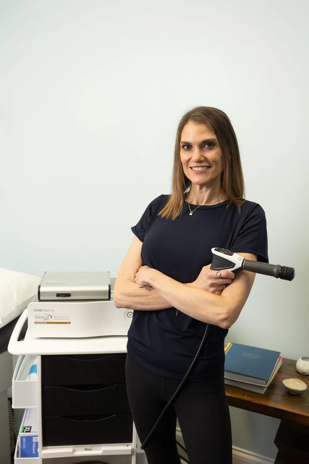 Amanda Carter, FNP-C with the GAINSWave shockwave therapy device